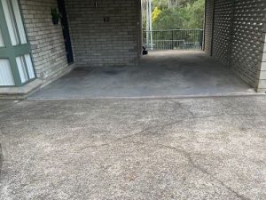 Cracked pebble crete driveway and concrete carport in western sydney