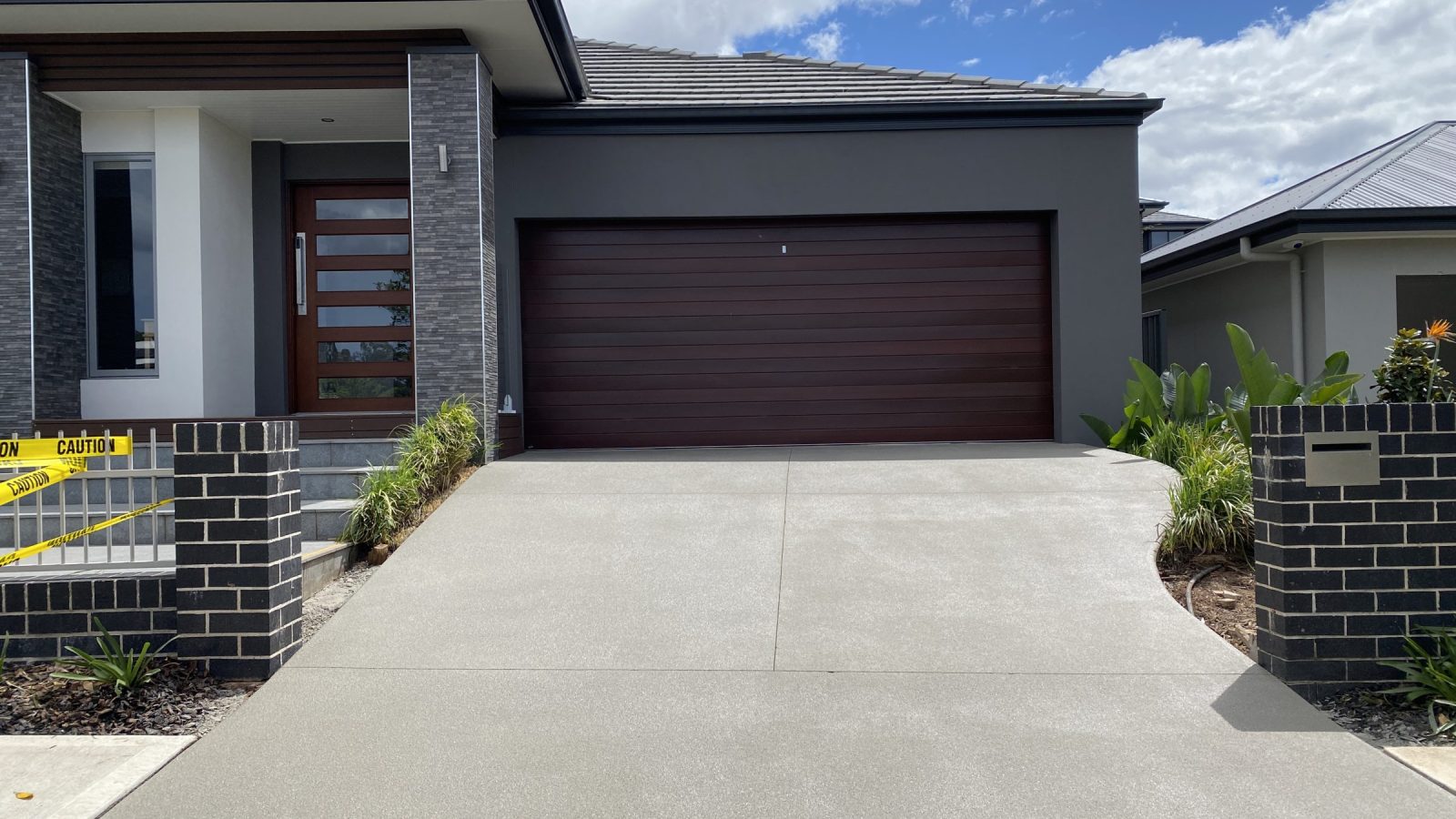 Concrete surface in Denham Court, South West Sydney after spray-on resurfacing in French Grey, with a textured non-slip finish