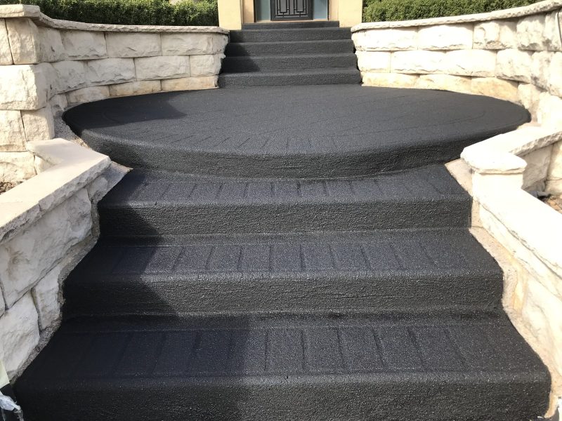 Stencil pattern driveway resurfaced with the pattern still visible