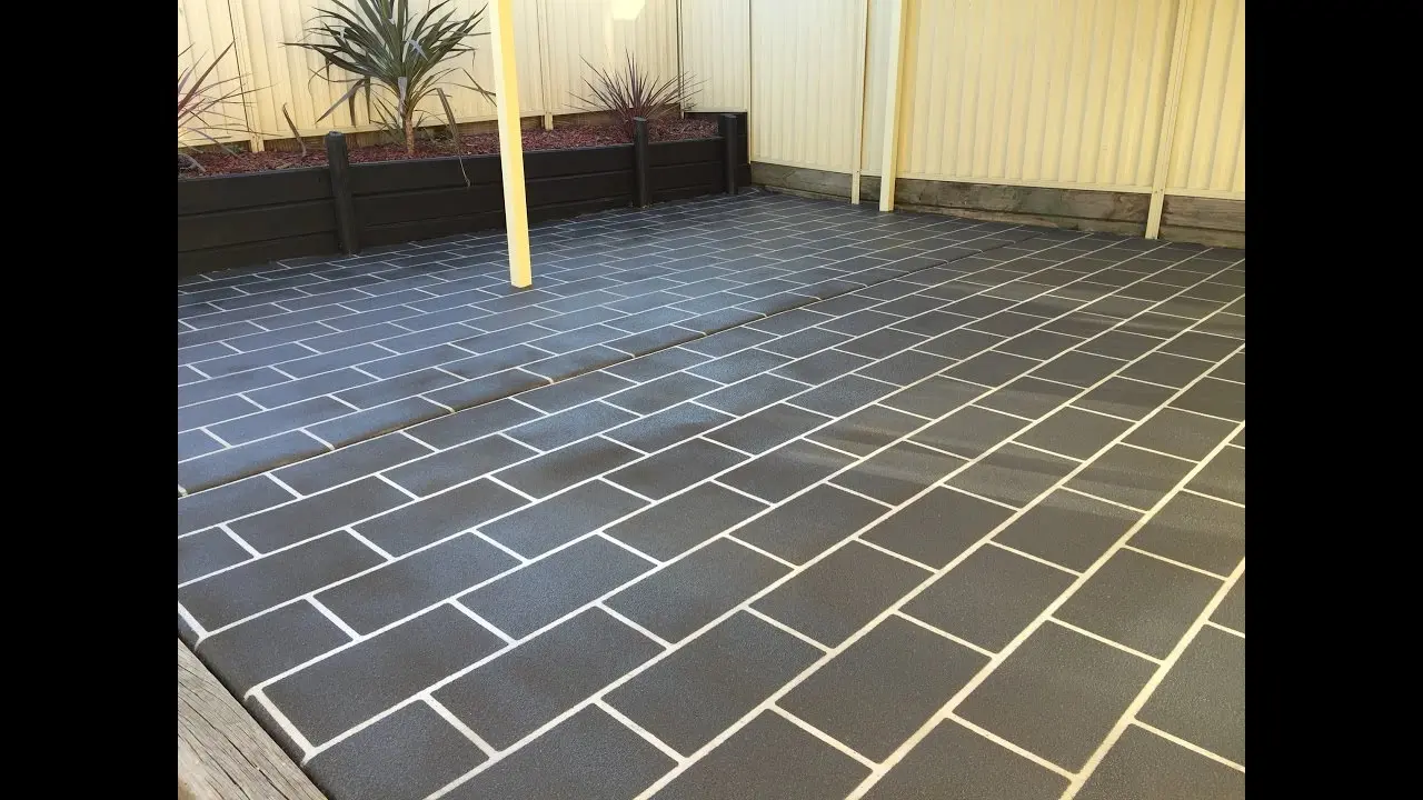 Royal Concrete Resurfacing spraying a driveway
